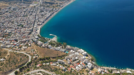 Obraz premium Aerial drone photo of famous seaside area, organised beach and bay of Loutraki town, Corinthian bay, Greece