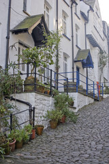 Fototapeta premium Clovelly is a harbour village in the Torridge district of Devon, England. Its steep pedestrianised cobbled main street, donkeys and views over the Bristol Channel attract numerous tourists.