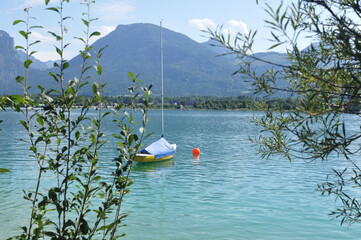 Italian lake with a sailboat