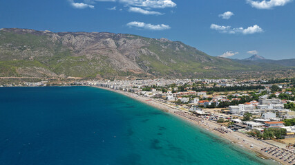 Aerial drone photo of famous seaside area, organised beach and bay of Loutraki town, Corinthian bay, Greece
