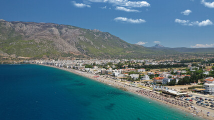 Aerial drone photo of famous seaside area, organised beach and bay of Loutraki town, Corinthian bay, Greece