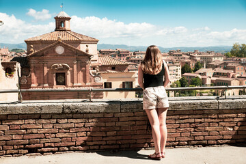 Girl enjoy views of Siena - Italy