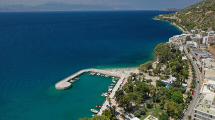 Aerial drone photo of famous seaside area, organised beach and bay of Loutraki town, Corinthian bay, Greece