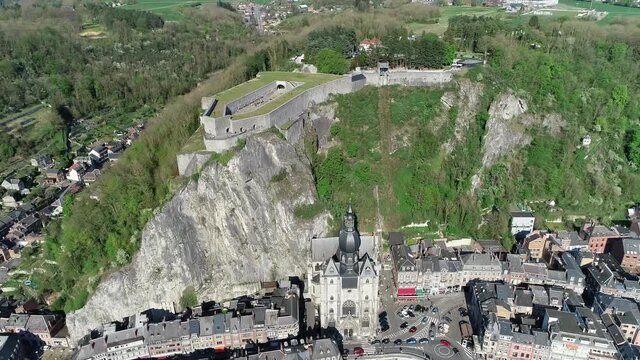 Aerial view of cathedral and fortress in Dinant is a Walloon city and municipality located on the River Meuse in the Belgian province of Namur in the Ardennes it is a popular tourist destination 4k