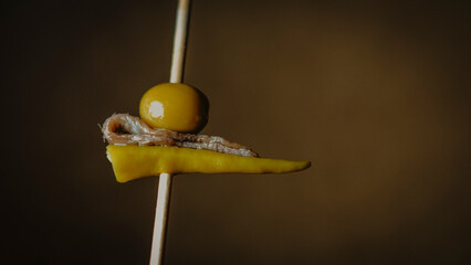 Photo of one of the most iconic Spanish pintxos called Gilda, which consists  of pepper, olive and...