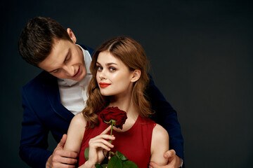 Beautiful couple charm hug lifestyle relationship rose luxury dark background