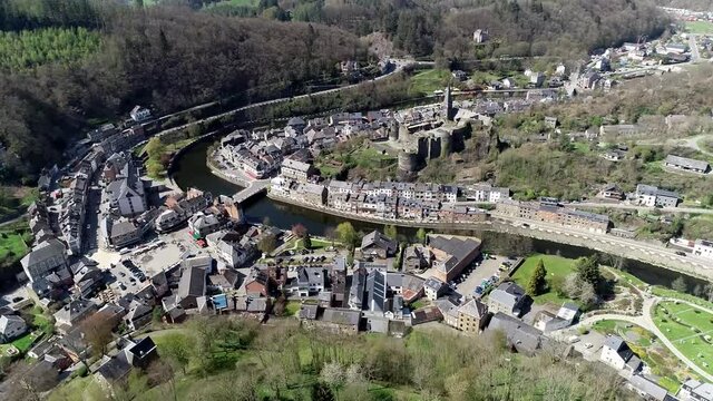 Aerial footage of La Roche en Ardenne is Walloon municipality of Belgium located beside a bend in the River Ourthe the small town is one of the most popular tourist destinations in the Ardennes 4k