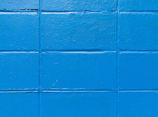 Close view of rows of old concrete blocks painted blue