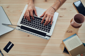 Woman working from home, using laptop / notebook, modern freelance concept.