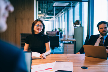 Smiling businesswoman on meeting in office boardroom