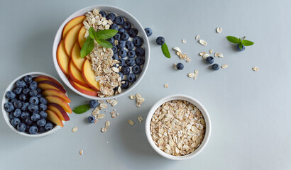 homemade yogurt bowl with peaches, blueberry and granola. Healthy breakfast. Clean eating, dieting, detox, vegetarian food concept.
