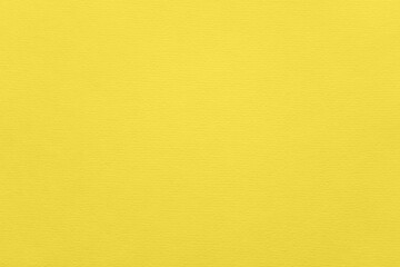 Fashionable pantone color of the year 2021 illuminating. Texture of illuminating colored paper for watercolor and pastel. Modern luxury background or mock up, copy space