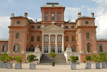 Fototapeta na wymiar The royal red castle of Racconigi is located in the province of Cuneo in Piedmont, but close to Turin. It is a Savoy residence from the fourteenth century.