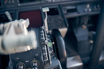Obraz na płótnie Canvas Airplane cockpit with thrust levers and instrument panel