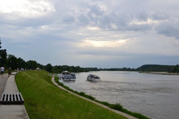 Fototapeta premium Kazimierz Dolny, Poland. Promenade on the banks of Vistula river. Popular place for tourists