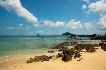 beach and sea with rocks  and cloud