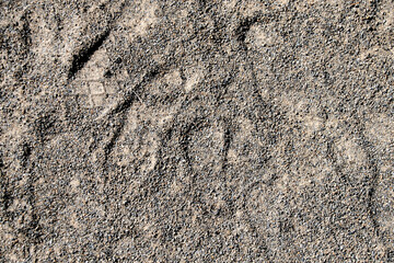 靴の足跡がついた地面　The ground with a lot of shoe  soles footprints 