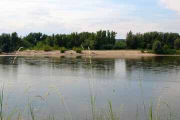 A beautiful view of the peaceful Vistula river. Summer day at the river Vistula, Kazimierz Dolny, Poland. The longest and largest river in Poland