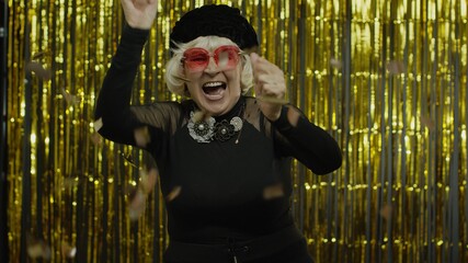 Obraz na płótnie Canvas Happy senior old woman shouting, celebrating success, winning lottery, goal achievement concept