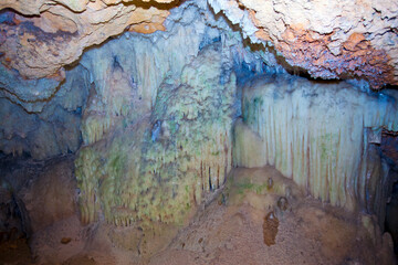 Indian Cave in Vinales, Cuba. Underground cave with stalactites and stalagmites, and river..