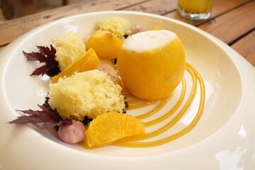 Lemon sorbet ice cream served on a white plate