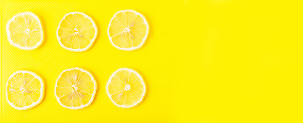 Lemon slices on a yellow Board close up