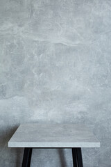 wooden table and grey wall background