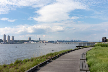 Fototapeta na wymiar Empty Walkway at Riverside Park South along the Hudson River in Lincoln Square New York during Summer