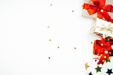 New Year's gift on a white background flatlay with space for text and lights, holiday gifts concept