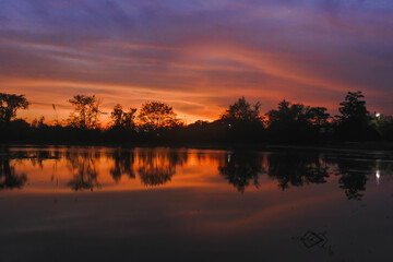 Naklejka premium sunset over the river