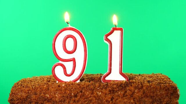 Cake with the number 91 lighted candle. Chroma key. Green Screen. Isolated