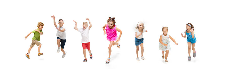 Happy children, little and emotional caucasian kids jumping and running isolated on white background. Looks happy, cheerful, sincere. Copyspace for ad. Childhood, education, happiness concept.