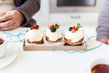 cake with cream and berries on the table
