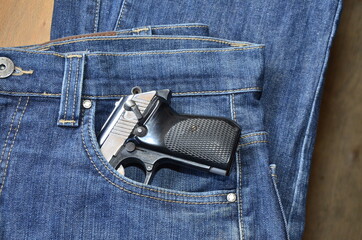 Gun in woman Jeans pocket, dangerous for many reasons
