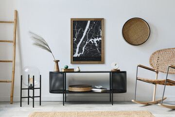 Modern scandinavian living room interior with mock up poster frame, design commode, leaf in vase, rattanarmchair, book and elegant accessories in stylish home decor. Template.