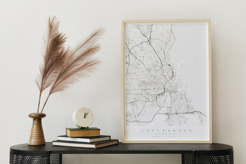 Modern scandinavian home interior with design wooden commode, mock up poster map, feather in vase, book and personal accessories in stylish home decor. Template.