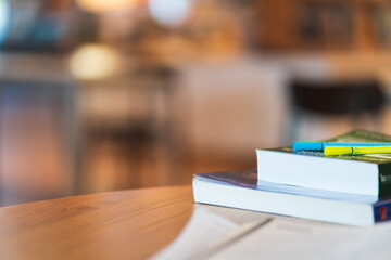 Close up stack of books on wood table