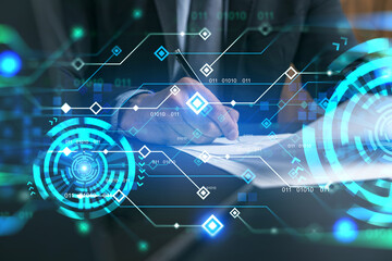 Businessman in suit signs contract. Double exposure with technology illustration hologram. New partnership in it business concept.