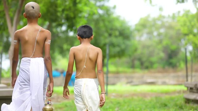 Young indian child  doing yoga in the park