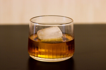 close up of bourbon on the rocks in a whiskey glass