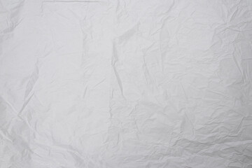 Crumpled white paper background.