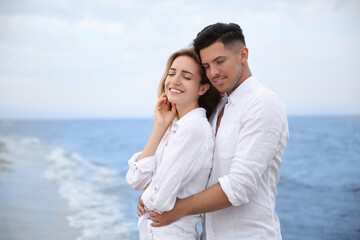 Happy couple on sea beach. Romantic walk