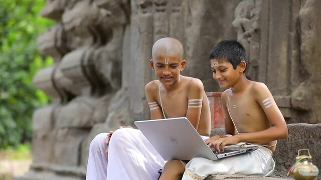 Young indian  child  with laptop