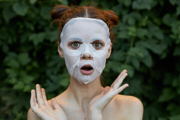 Portrait of a girl white mask Wide eyed surprise and open lessons skin care 