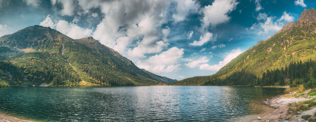 Tatra National Park, Poland. Famous Mountains Lake Morskie Oko Or Sea Eye Lake In Summer Morning. Beautiful Sunrise Sunrays Above Tatras Lake Landscape © Great Brut Here