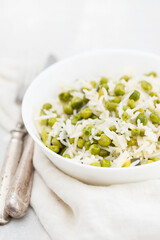 boiled rice with green vegetables in the dish