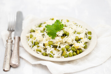boiled rice with green vegetables in the dish