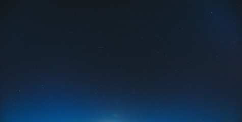 Obraz premium Night Starry Sky With Glowing Stars. Night Starry Sky Blue Background Backdrop