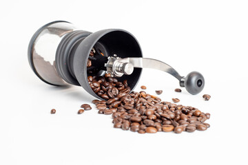 coffee grinder with coffee beans on white background