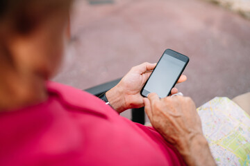 Man using smartphone on street
